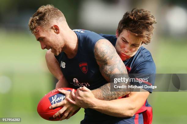 Jack Viney, coming back from a serious leg injury, tackles Dean Kent of the Demons during a Melbourne Demons AFL training session at Gosch's Paddock...