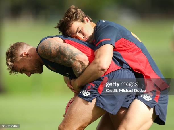 Jack Viney, coming back from a serious leg injury, tackles Dean Kent of the Demons during a Melbourne Demons AFL training session at Gosch's Paddock...