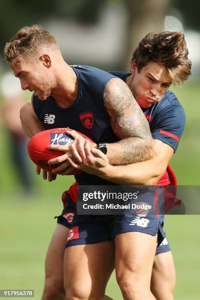 Jack Viney, coming back from a serious leg injury, tackles Dean Kent of the Demons during a Melbourne Demons AFL training session at Gosch's Paddock...