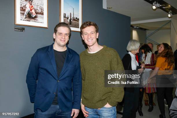 Dominik Elstner and German actor Artjom Gilz during the exhibition opening 'PortrAid - Get art. Give work.' at DRIVE Volkswagen Group Forum on...