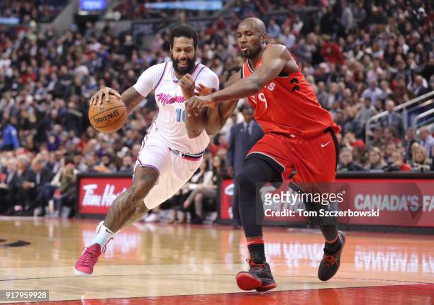 James Johnson of the Miami Heat drives to the basket against Serge Ibaka of the Toronto Raptors at Air Canada Centre on February 13, 2018 in Toronto,...