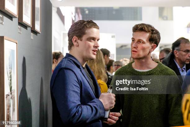 Dominik Elstner and German actor Artjom Gilz during the exhibition opening 'PortrAid - Get art. Give work.' at DRIVE Volkswagen Group Forum on...