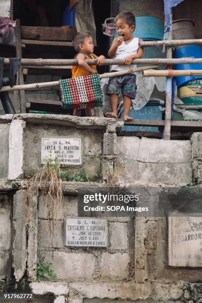 Children seen playing at the graveyard at the cemetery. In the center of Pasay District of Metro Manila is a cemetery where over 10,000 deceased...