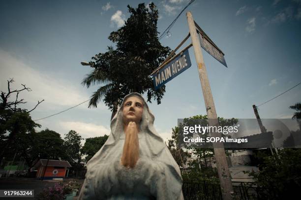 Statue of Mother Mary seen at the cemetery. In the center of Pasay District of Metro Manila is a cemetery where over 10,000 deceased people is...