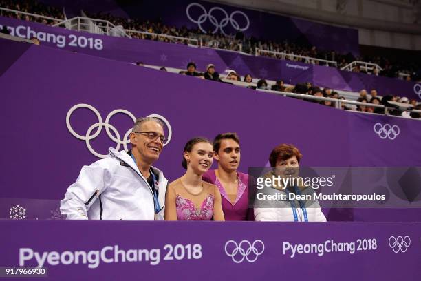 Anna Duskova and Martin Bidar of the Czech Republic sit with coaches after their routine during the Pair Skating Short Program on day five of the...
