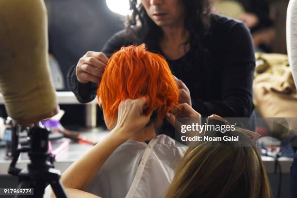 Model prepares backstage for Zang Toi during New York Fashion Week: The Shows at Pier 59 on February 13, 2018 in New York City.