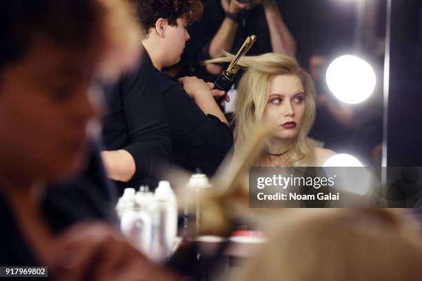 Model prepares backstage for Zang Toi during New York Fashion Week: The Shows at Pier 59 on February 13, 2018 in New York City.