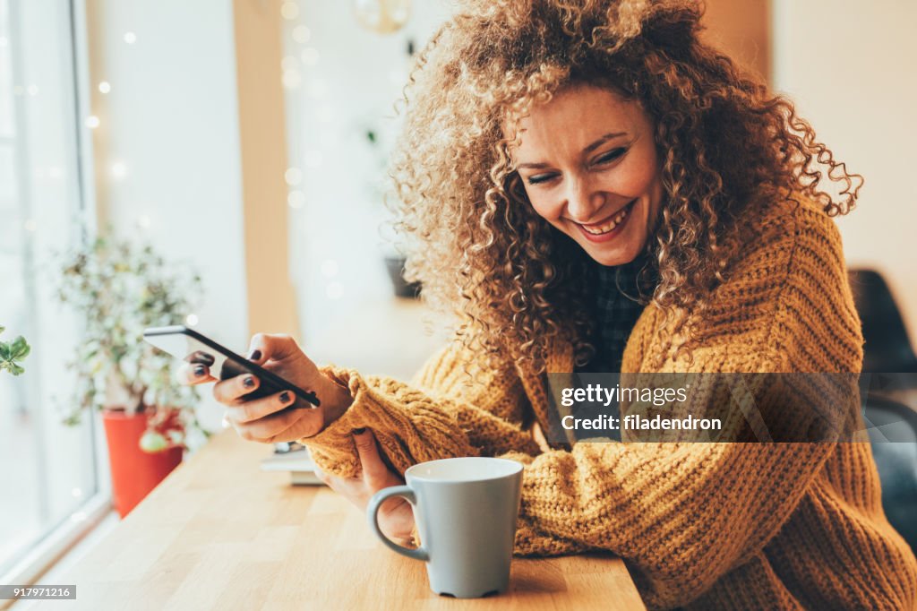 Pretty woman texting on the phone