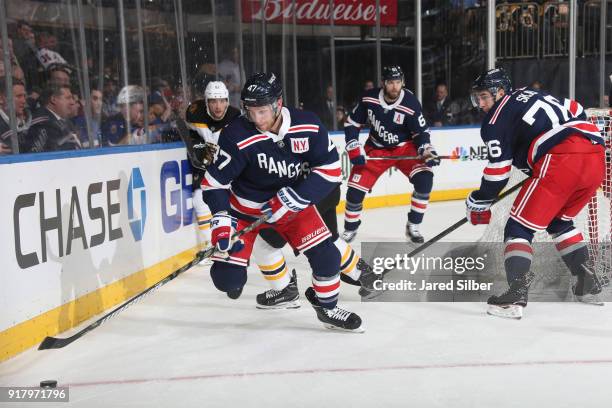 Steven Kampfer of the New York Rangers skates with the puck against the Boston Bruins at Madison Square Garden on February 7, 2018 in New York City....