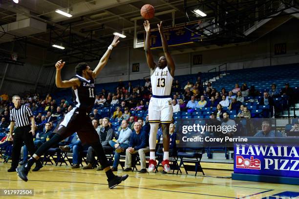 Saul Phiri of the La Salle Explorers shoots a three point basket against Courtney Stockard of the St. Bonaventure Bonnies during the second half at...