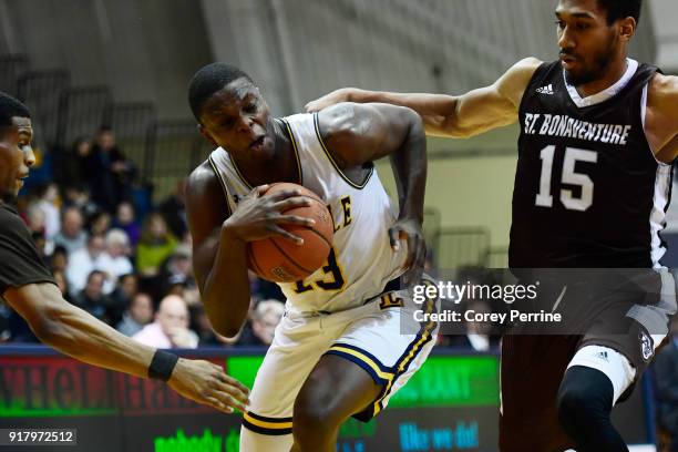 Saul Phiri of the La Salle Explorers is fouled by LaDarien Griffin as teammate Idris Taqqee of the St. Bonaventure Bonnies pressures during the...