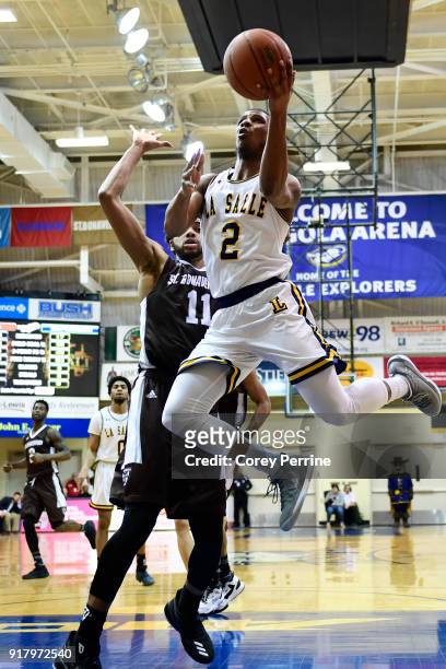 Amar Stukes of the La Salle Explorers drives to the basket against Courtney Stockard of the St. Bonaventure Bonnies during the second half at Tom...
