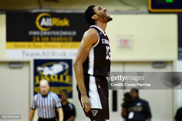 LaDarien Griffin of the St. Bonaventure Bonnies lets out a yell against the La Salle Explorers after a dunk from teammate Courtney Stockard during...