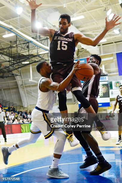 Amar Stukes of the La Salle Explorers is fouled by LaDarien Griffin as Matt Mobley of the St. Bonaventure Bonnies pressures during the second half at...