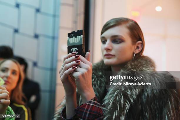 Model takes a selfie backstage at the Calvin Luo fashion show during New York Fashion Week on February 13, 2018 in New York City.