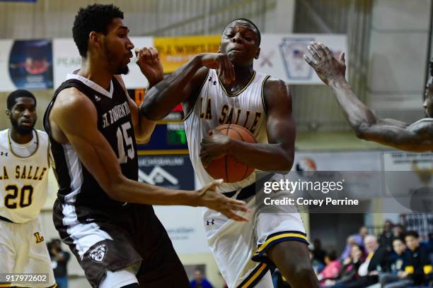 Saul Phiri of the La Salle Explorers is fouled by LaDarien Griffin of the St. Bonaventure Bonnies during the second half at Tom Gola Arena on...