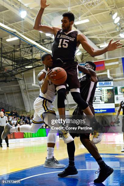 Amar Stukes of the La Salle Explorers is fouled by LaDarien Griffin as Matt Mobley of the St. Bonaventure Bonnies pressures during the second half at...