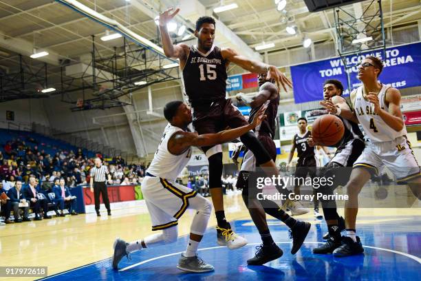 Amar Stukes of the La Salle Explorers is fouled by LaDarien Griffin as Matt Mobley of the St. Bonaventure Bonnies pressures during the second half at...