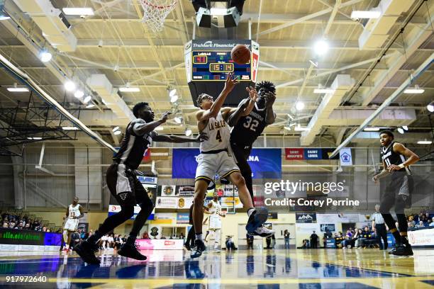 Miles Brookins of the La Salle Explorers and Amadi Ikpeze of the St. Bonaventure Bonnies vie for the ball during the second half at Tom Gola Arena on...