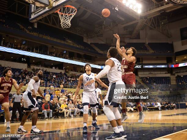 Jerome Robinson of the Boston College Eagles puts up a shot over Shamiel Stevenson of the Pittsburgh Panthers in the second half during the game at...