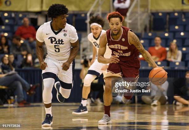 Ky Bowman of the Boston College Eagles dribbles against Marcus Carr of the Pittsburgh Panthers in the second half during the game at Petersen Events...