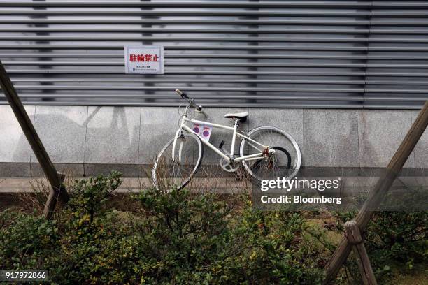 Bicycle stands in front of a no parking sign in a shopping area of Yokohama, Japan, on Monday, Jan. 29, 2018. Japans economy expanded for an eighth...