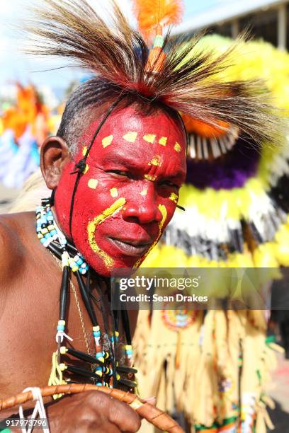 Masquerader of the mas group Legacy looks on during the presentation of the band titled 'We Jamming Still' as part of Trinidad Carnival at the...