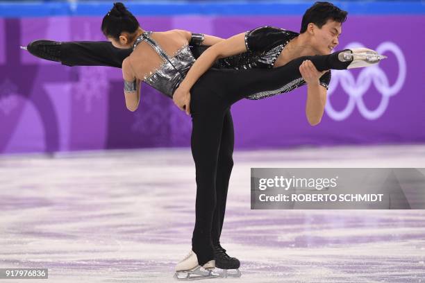 North Korea's Kim Ju Sik and North Korea's Ryom Tae Ok compete in the pair skating short program of the figure skating event during the Pyeongchang...