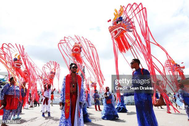 Masqueraders of the mas group K2K Alliance & Partners look on during the presentation of the band titled 'We Stand United' as part of Trinidad...