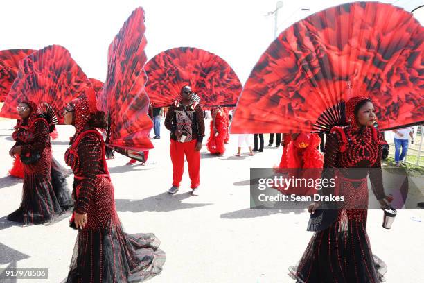 Masqueraders of the mas group K2K Alliance & Partners look on during the presentation of the band titled 'We Stand United' as part of Trinidad...