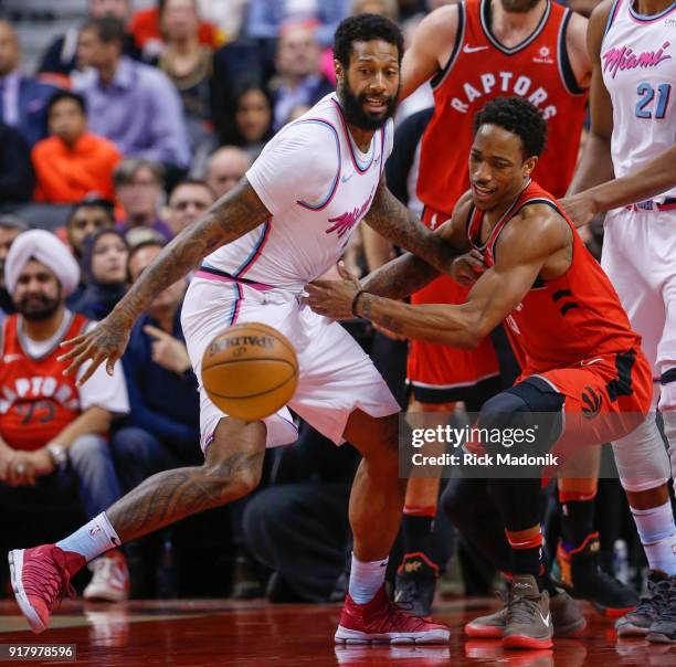 Former teammate Miami Heat forward James Johnson defends against Toronto Raptors guard DeMar DeRozan who lost the handle on the ball. Toronto Raptors...