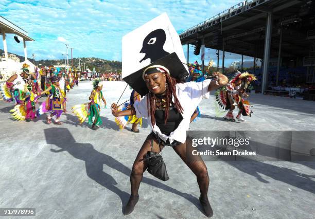 Masquerader of the mas group Cat in Bag Productions performs during the presentation of the band titled 'Big Head' as part of Trinidad Carnival at...