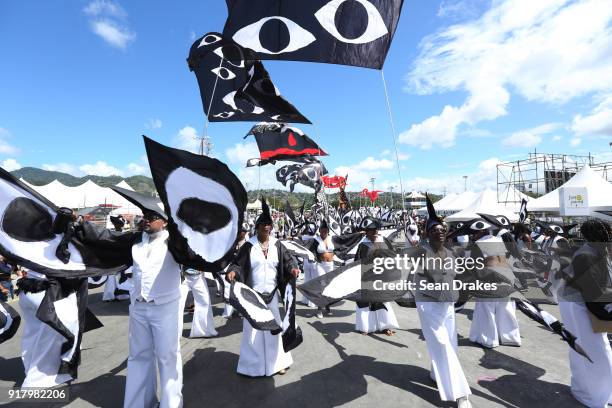 Masqueraders of the Republic Bank Exodus Steel Orchestra and Minshall Mas perform during the presentation of the band titled 'The Eyes of God' as...