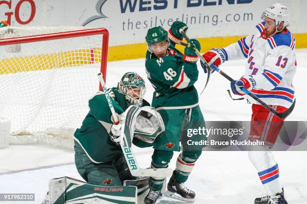 Kevin Hayes of the New York Rangers scores a goal against Jared Spurgeon and goalie Devan Dubnyk of the Minnesota Wild during the game at the Xcel...
