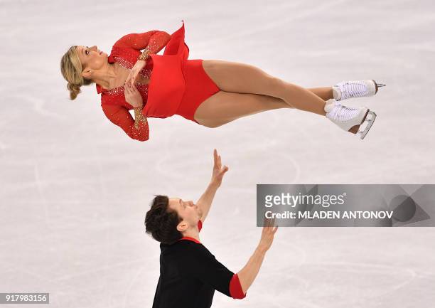 Canada's Kirsten Moore-Towers and Canada's Michael Marinaro compete in the pair skating short program of the figure skating event during the...