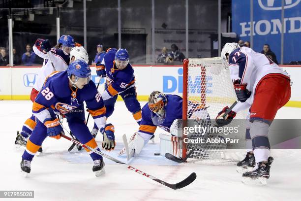 Jaroslav Halak of the New York Islanders blocks a shot by Josh Anderson of the Columbus Blue Jackets in the first period during their game at...