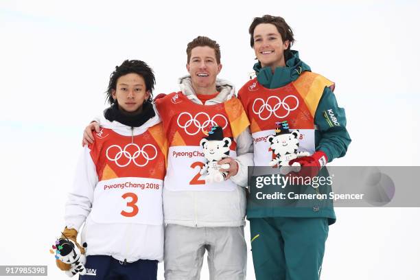 Silver medalist Ayumu Hirano of Japan, gold medalist Shaun White of the United States and bronze medalist Scotty James of Australia pose during the...