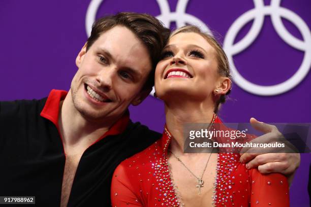 Kirsten Moore-Towers and Michael Marinaro of Canada react after their routine during the Pair Skating Short Program on day five of the PyeongChang...