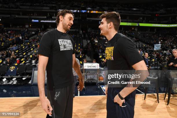 Pau Gasol of the San Antonio Spurs and Juan Hernangomez of the Denver Nuggets talk before the game on February 13, 2018 at the Pepsi Center in...