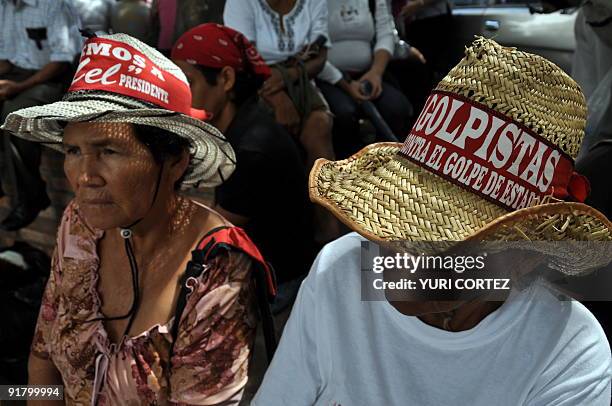 Supporters of deposed Honduran president Manuel Zelaya take part in a protest at the Kenedy neighborhood in Tegucigalpa on October 12, 2009. Zelaya...