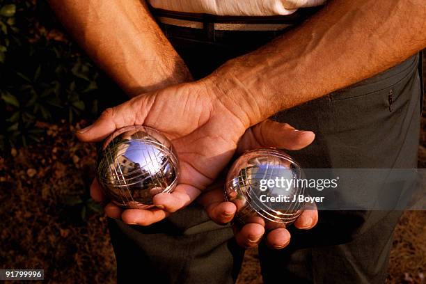 man with silver balls - petanque stock pictures, royalty-free photos & images