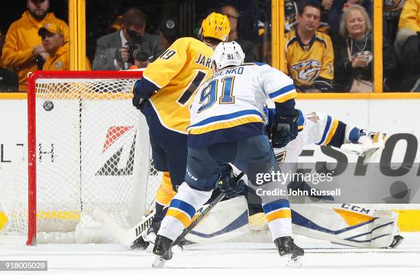Calle Jarnkrok of the Nashville Predators scores on a rebound against Carter Hutton of the St. Louis Blues during an NHL game at Bridgestone Arena on...