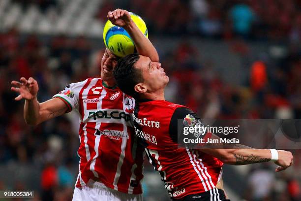 Igor Lichnovsky of Necaxa heads for the ball with Milton Caraglio of Atlas during the 7th round match between Atlas and Necaxa as part of the Torneo...