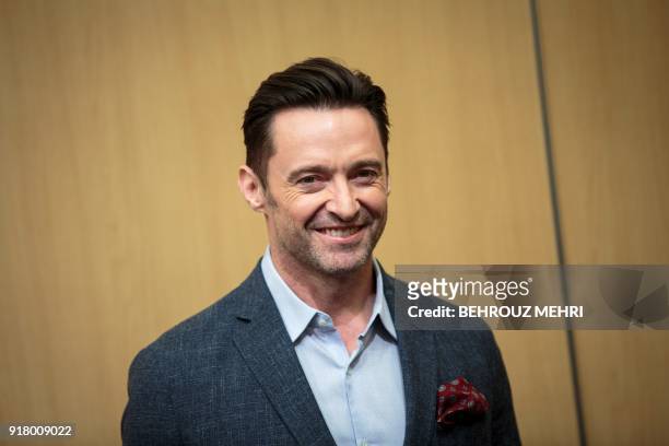 Australian actor Hugh Jackman poses during a photo session ahead of a press conference for his latest film "The Greatest Showman" in Tokyo on...