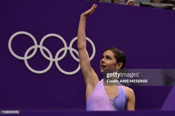 Russia's Natalia Zabiiako and Russia's Alexander Enbert react after competing in the pair skating short program of the figure skating event during...