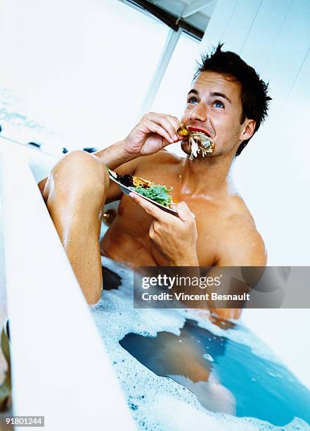 man eating in bathtub - scared chicken stock pictures, royalty-free photos & images