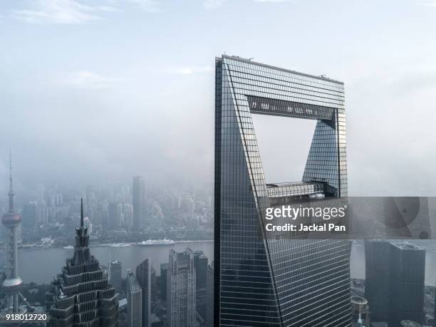 aerial view of shanghai lujiazui financial district in fog - shanghai tower shanghai photos et images de collection