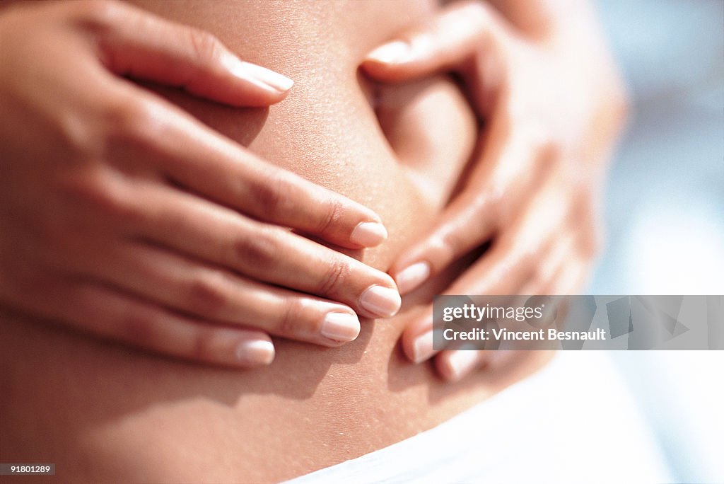 Woman holding stomach
