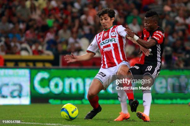 Victor Davila of Necaxa fights for the ball with Clifford Aboagye of Atlas during the 7th round match between Atlas and Necaxa as part of the Torneo...