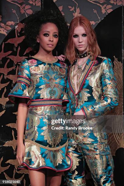 Models pose at the Alice + Olivia By Stacey Bendet Presentation during New York Fashion Week at Industria Studios on February 13, 2018 in New York...